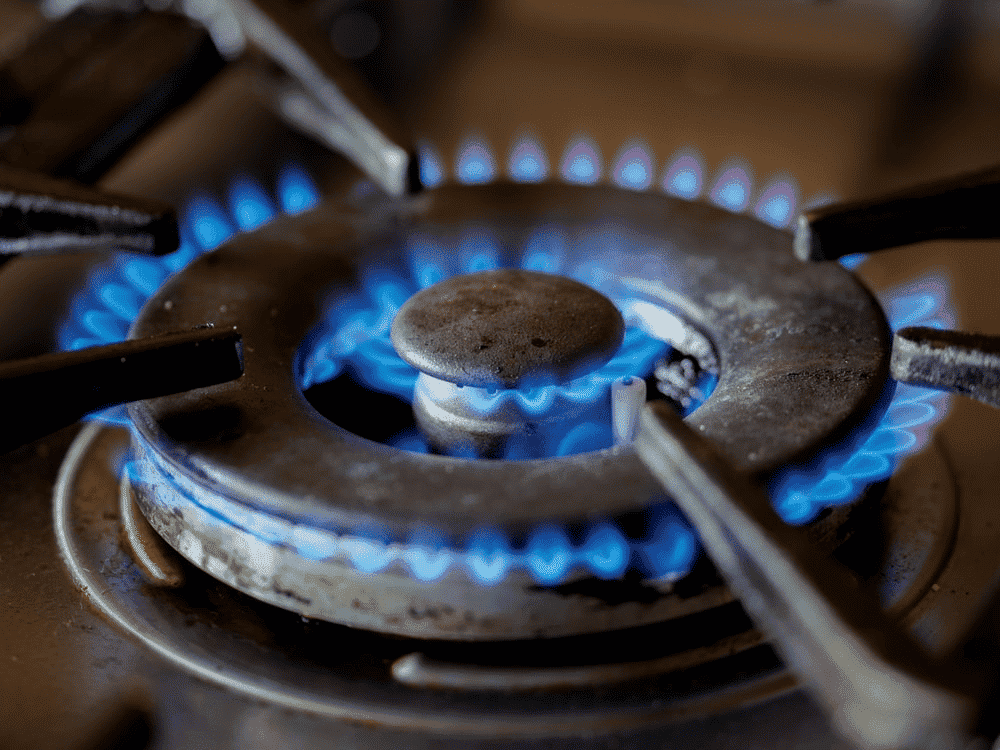 blue gas flame on a kitchen stove