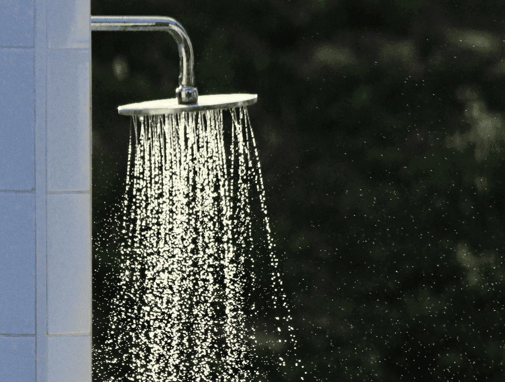 Water flowing out of a showerhead.